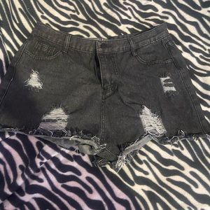 black ripped jean shorts